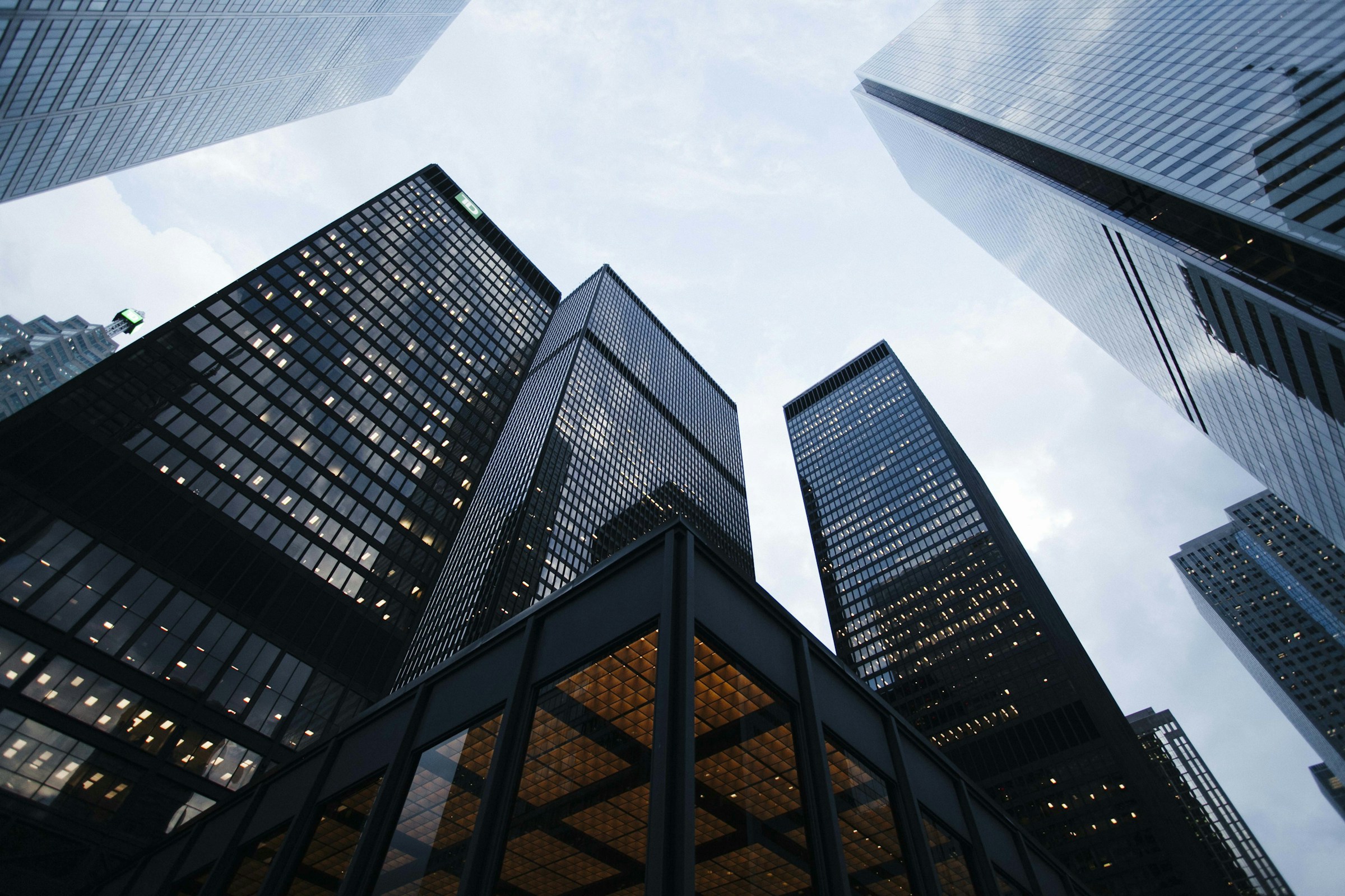 Modern glass office towers viewed from street level